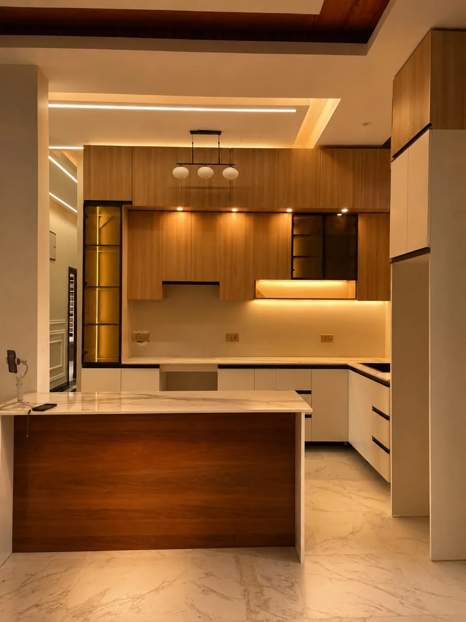 Fitted kitchen with timber cabinetry and marble island